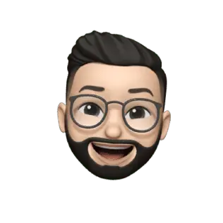 A memoji of a bearded person with glasses, short dark hair, and a big smile.